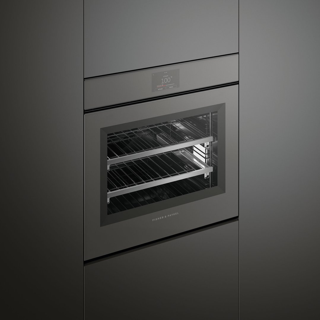 A built-in Fisher & Paykel Combi-Steam Oven with its door closed, showing the interior