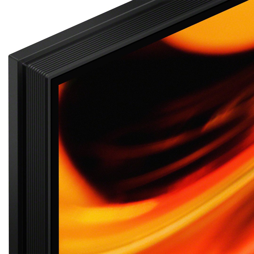 Close-up of the top left corner of a television displaying abstract orange and black colors