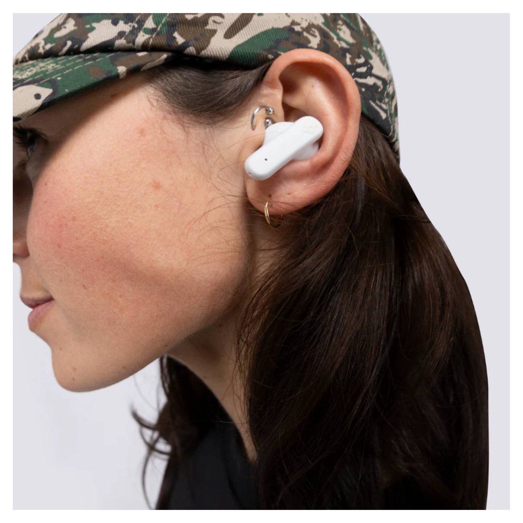 Woman wearing a white Skullcandy Smokin Buds TWS in-ear headset