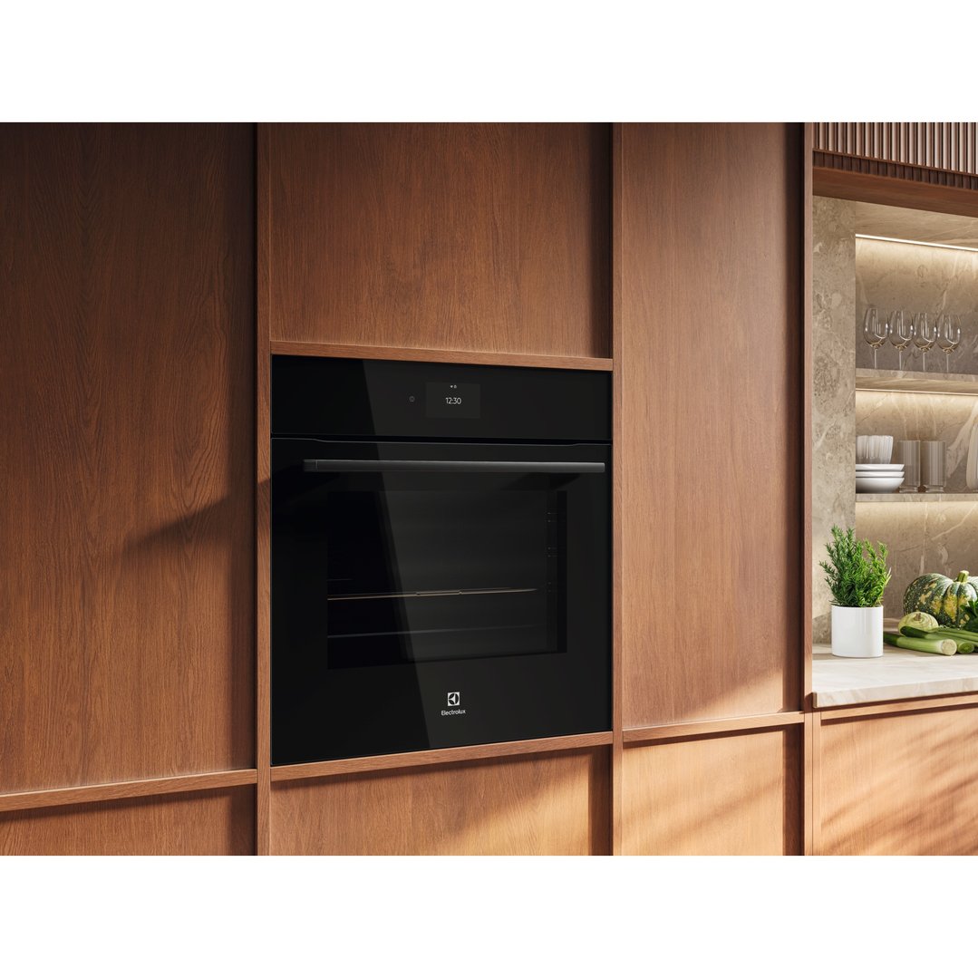 Built-in Electrolux oven in a modern kitchen with wooden cabinetry