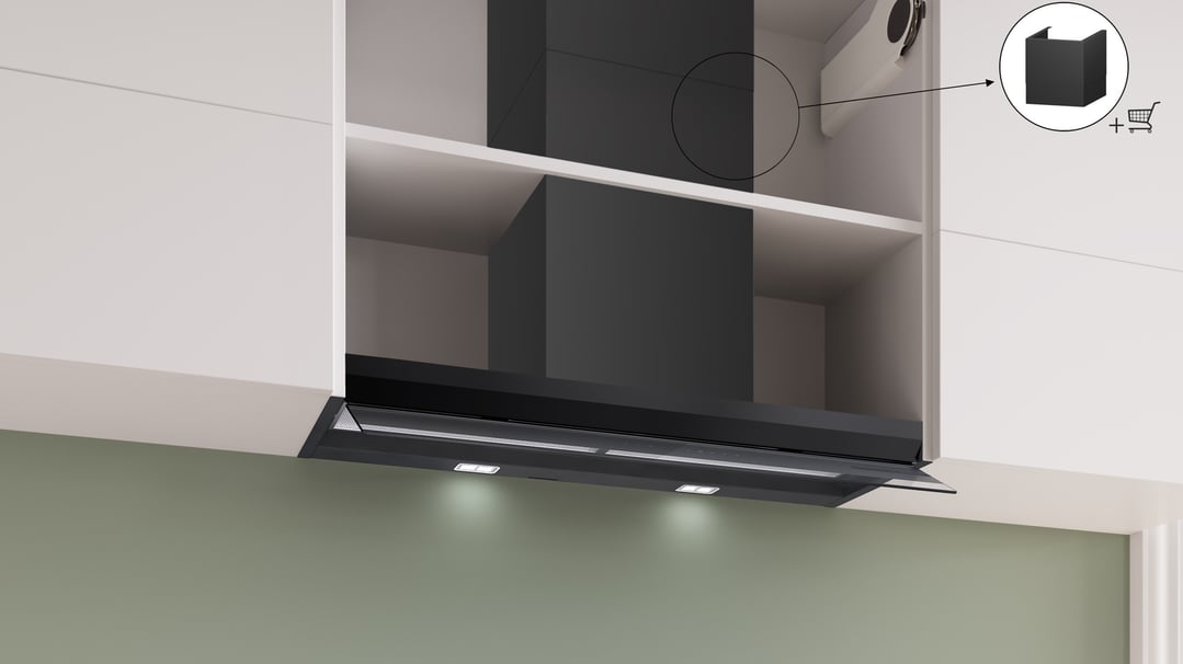 Black integrated rangehood installed in a kitchen cabinet with lights on