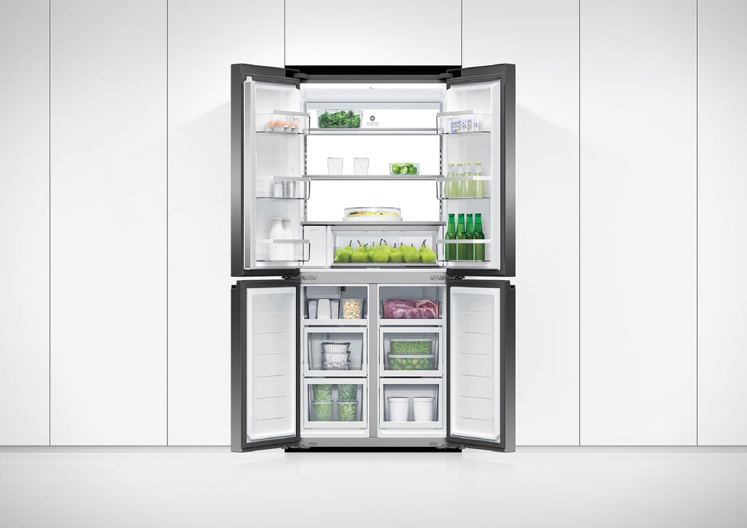 Open Fisher & Paykel 498L Series 7 Quad Door Refrigerator Freezer in a white kitchen