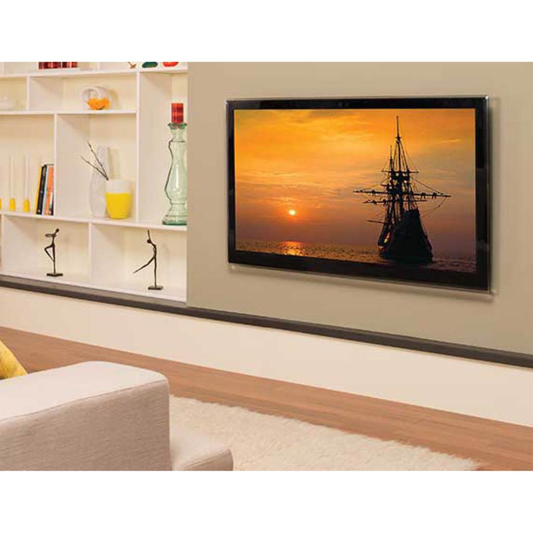 A TV wall-mounted in a living room above a white shelf