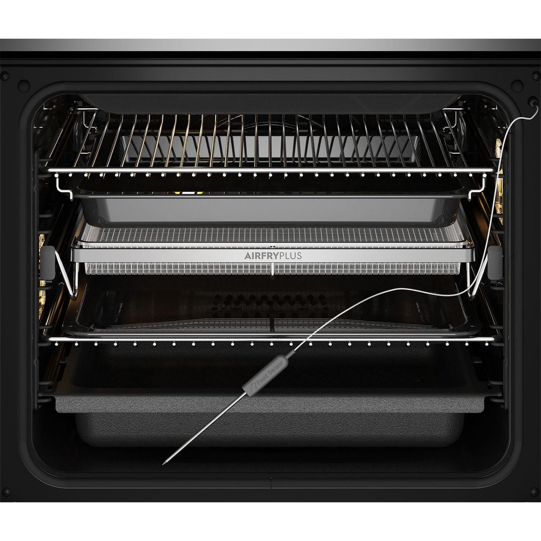 Inside view of an oven with an air fryer basket and food sensor