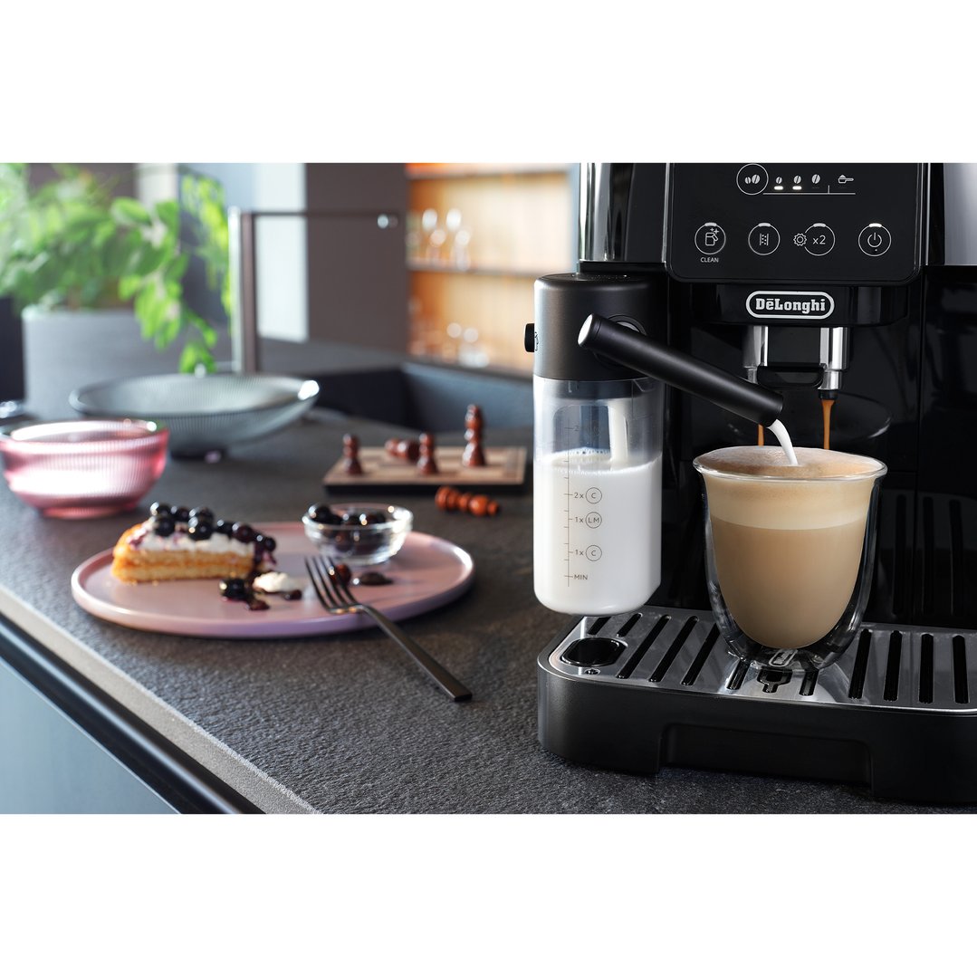 DELONGHI Magnifica Start coffee machine making a latte in a kitchen setting