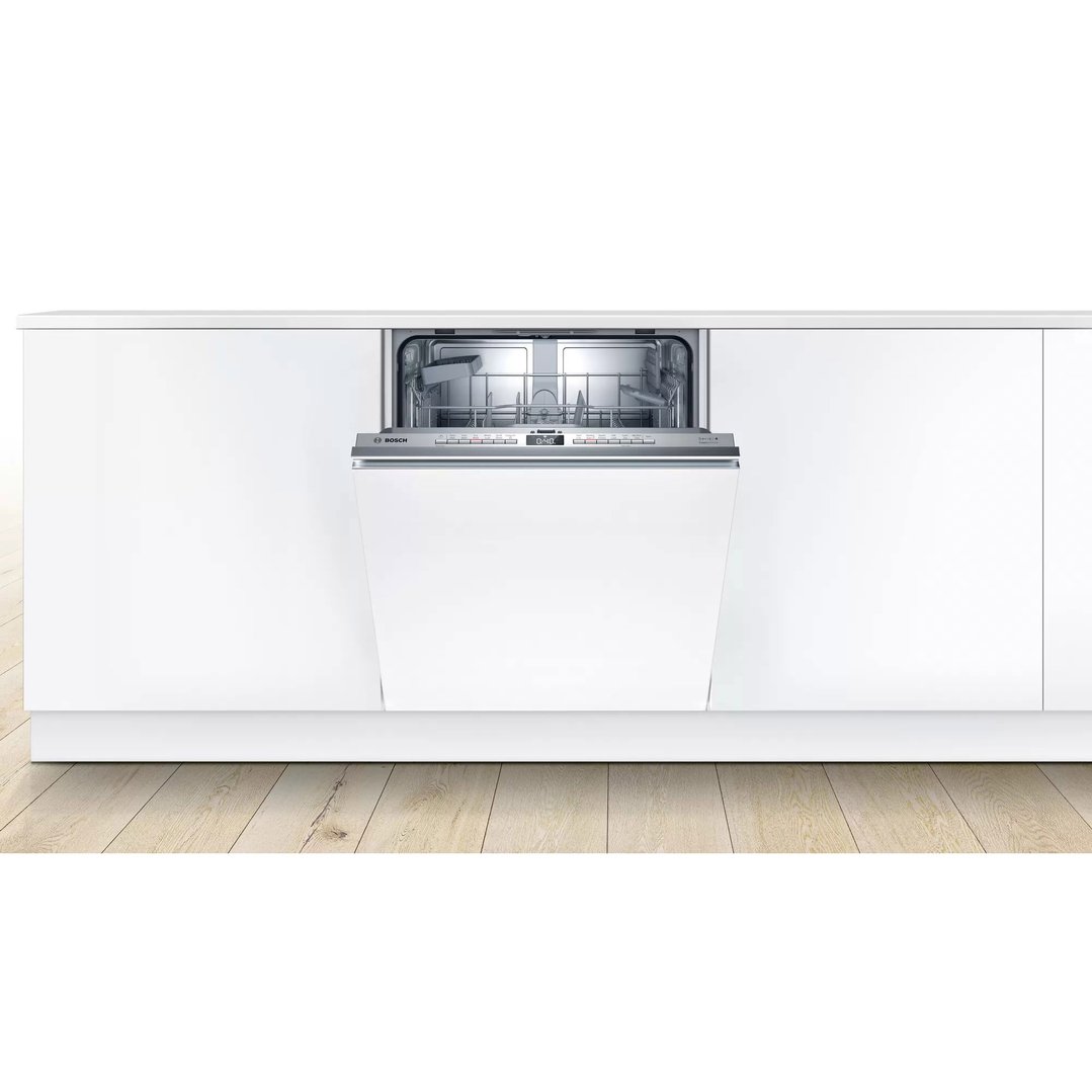 Fully integrated dishwasher with door open in a white kitchen setting