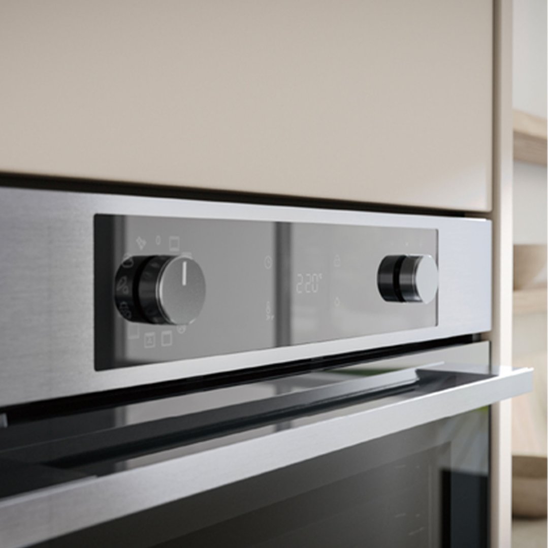 Built-in oven with stainless steel finish and control panel in a kitchen setting