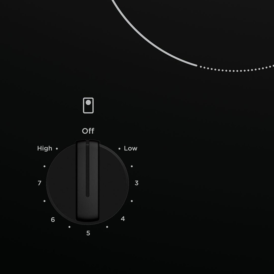 Close-up of a cooktop control knob with settings from Off to High