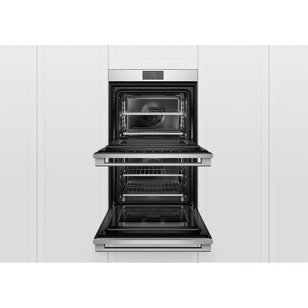 Double oven with both doors open, showing racks inside, built into white cabinetry