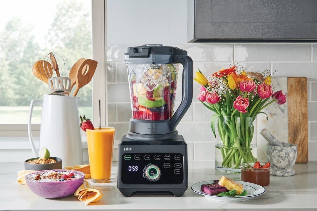 Braun PowerBlend 9 Jug Blender on a kitchen counter with fruits and flowers