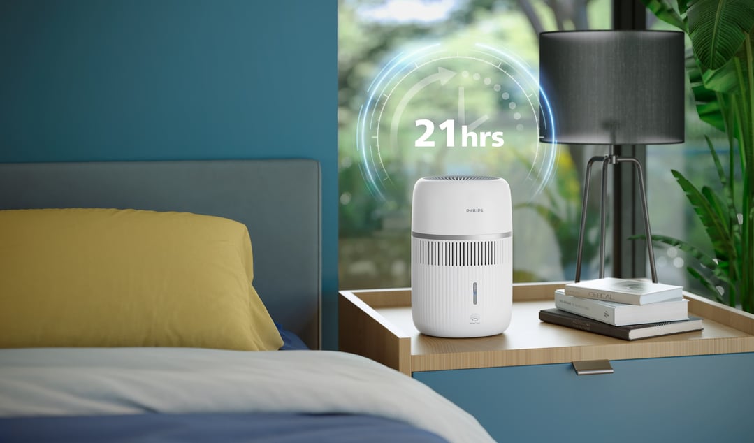 Philips Air Humidifier on a bedside table in a bedroom setting