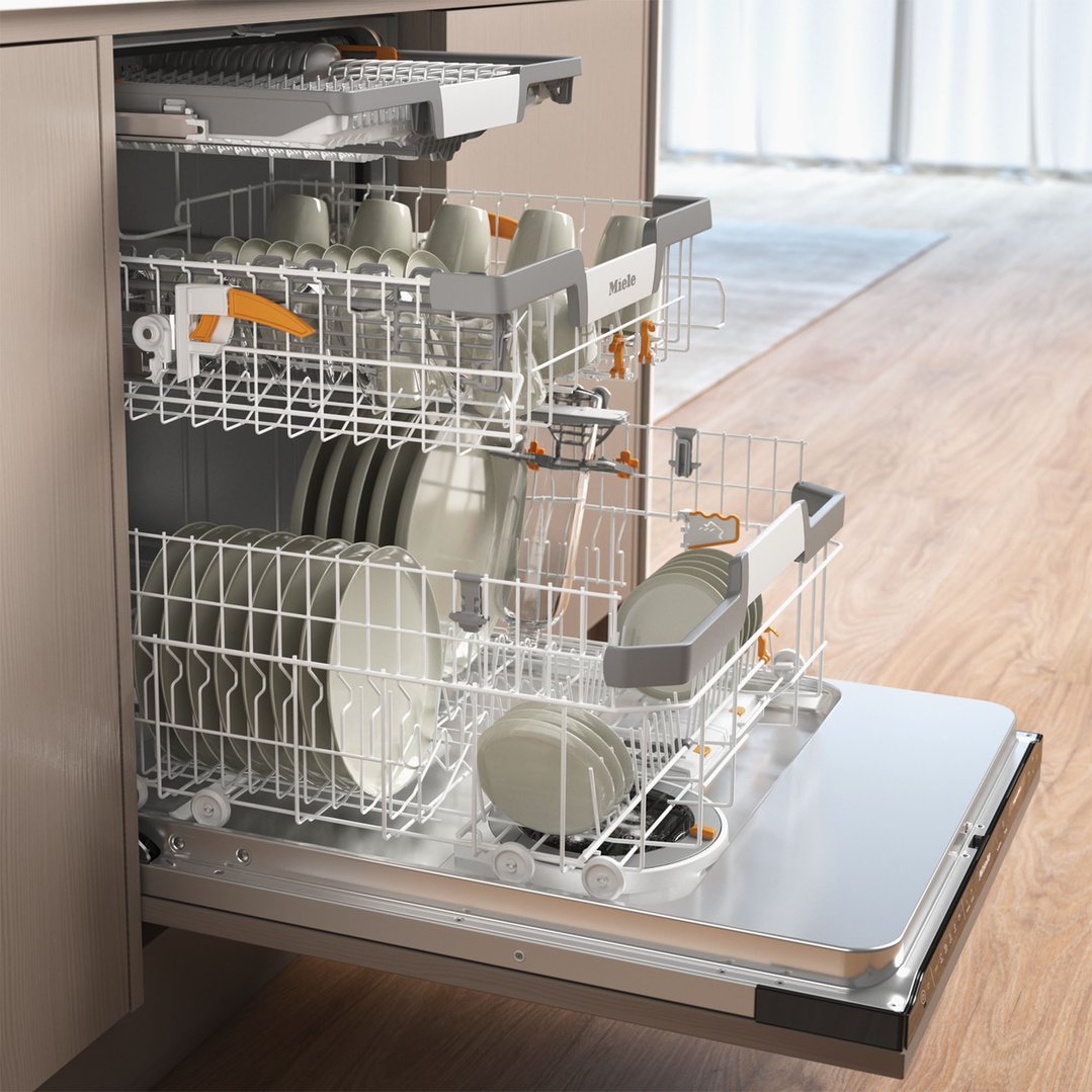 Open dishwasher with clean dishes inside, in a modern kitchen setting