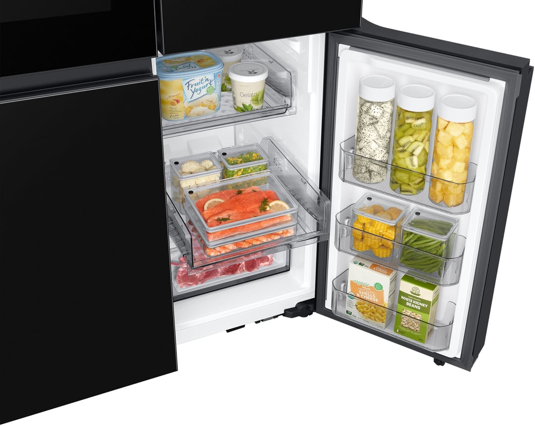 Open SAMSUNG 4-Door French Door Refrigerator with food items inside