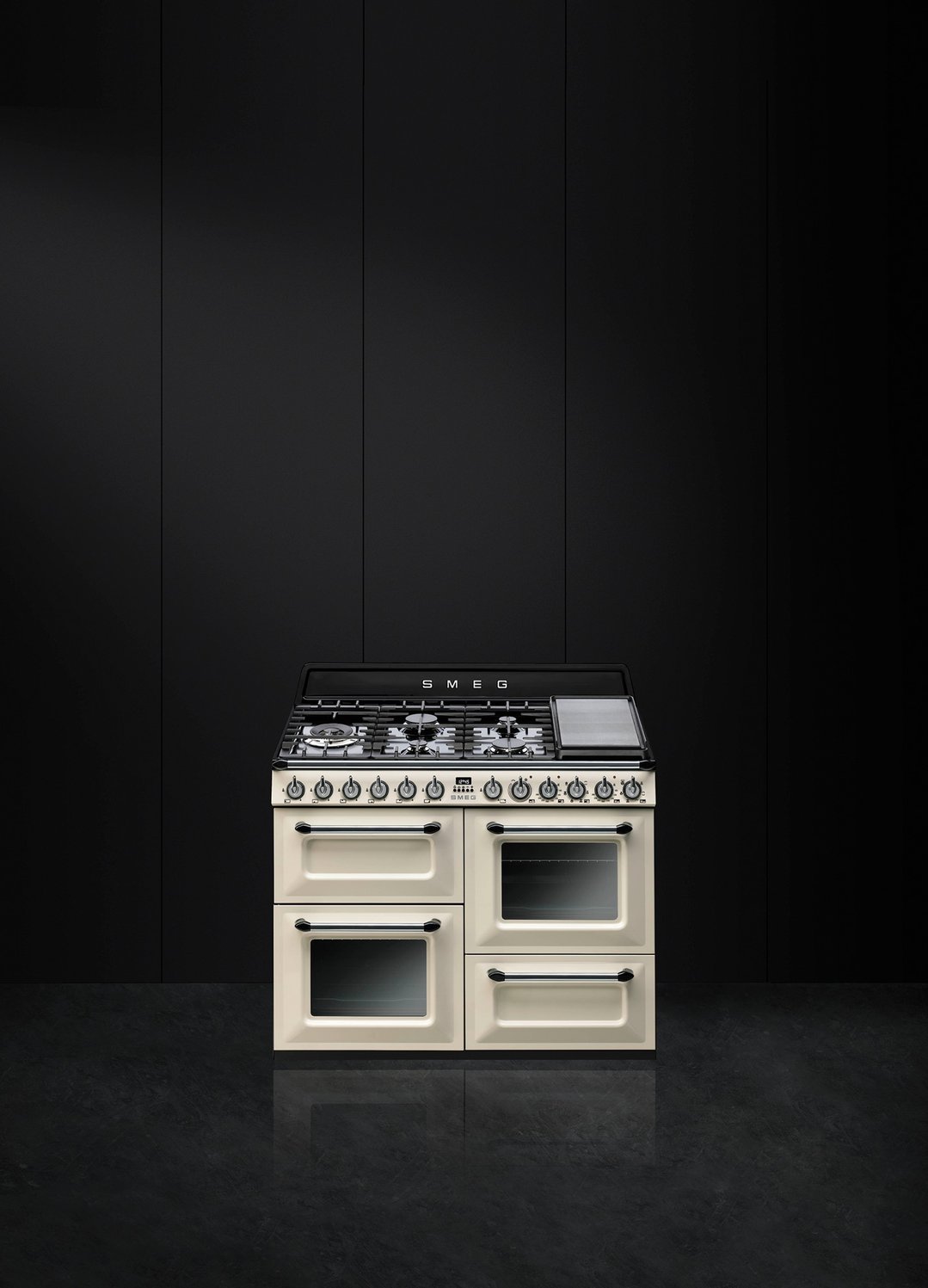Cream freestanding dual fuel oven/stove in a dark kitchen setting