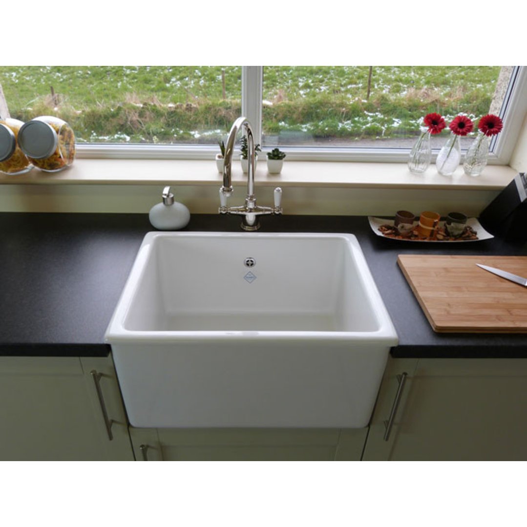Whitehall Sink with chrome tap in a kitchen setting with window view