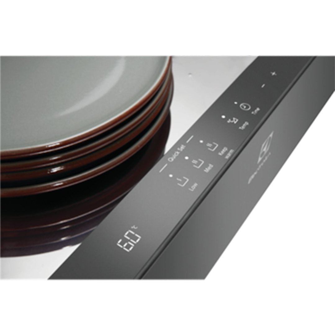 Close up of a warming drawer with plates stacked on top