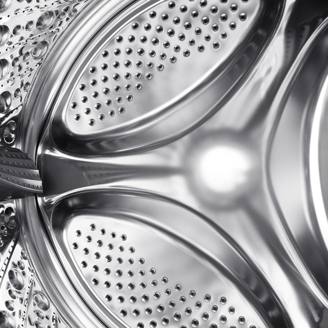 Close-up of the stainless steel drum interior of a washer dryer combo