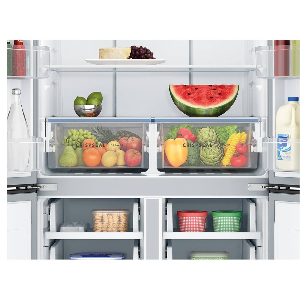Open refrigerator interior filled with various fresh foods and drinks