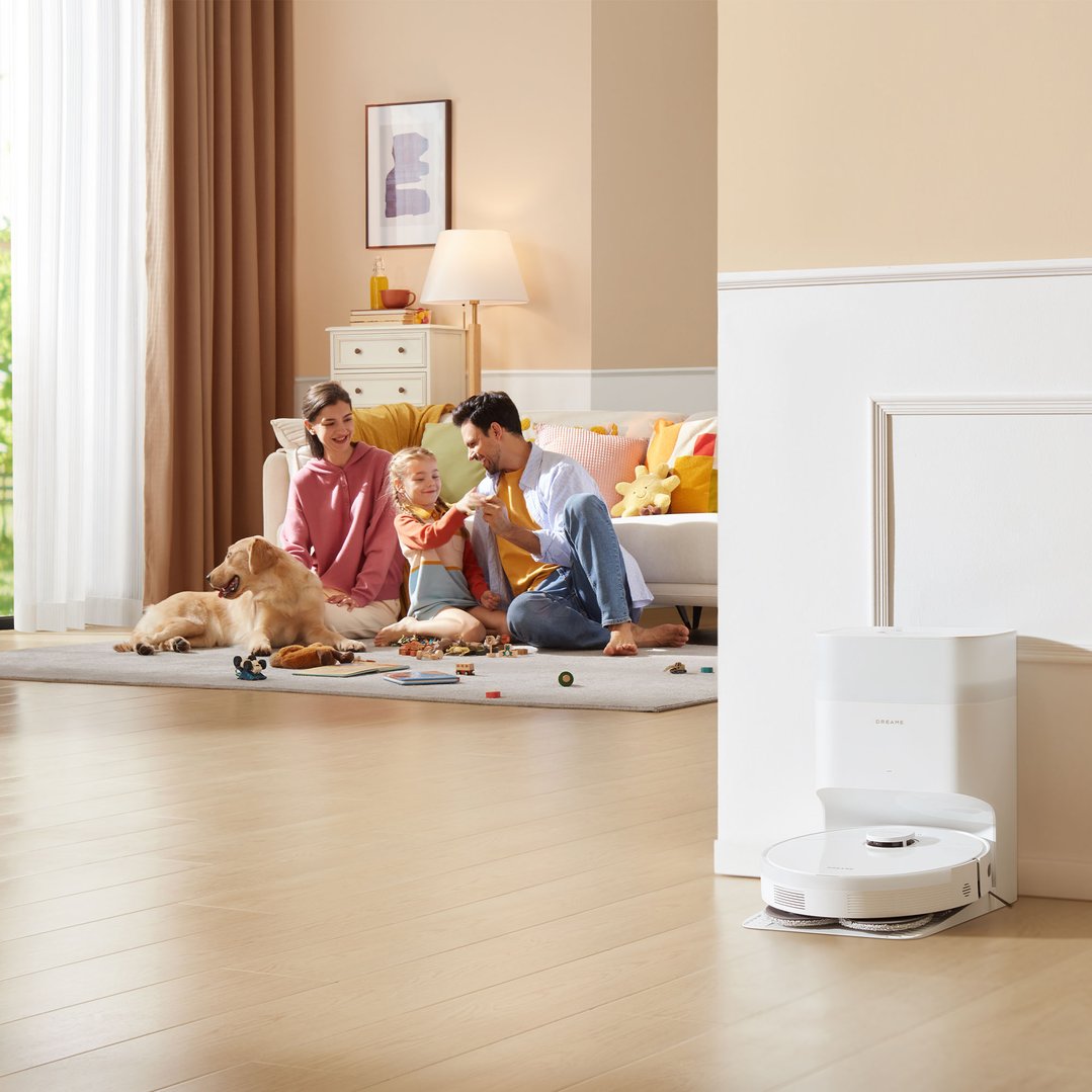 L10s Plus Robot Vacuum Cleaner and Dock in a living room with a family