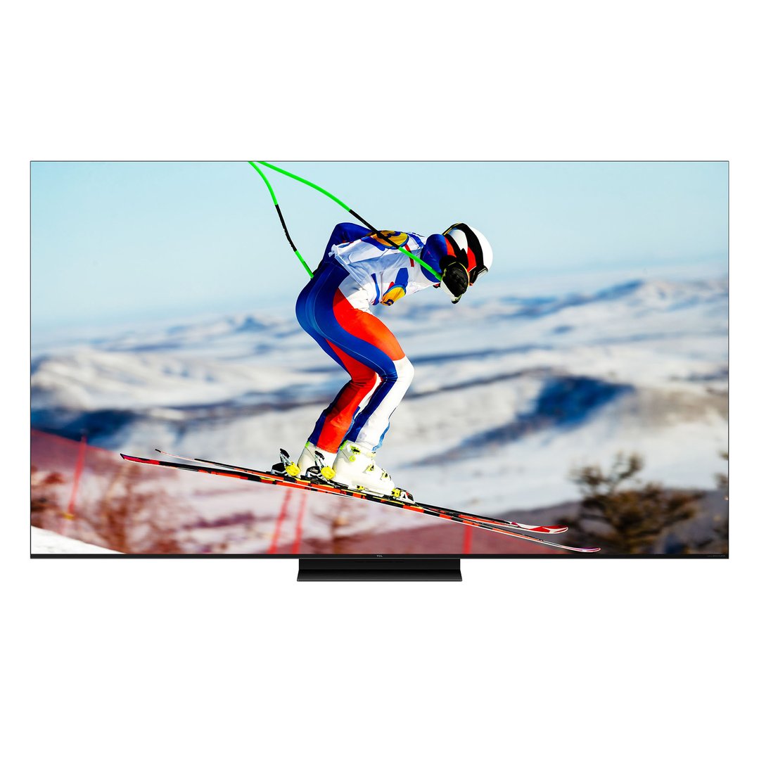 TCL TV displaying a skier in a snowy mountain landscape on a stand