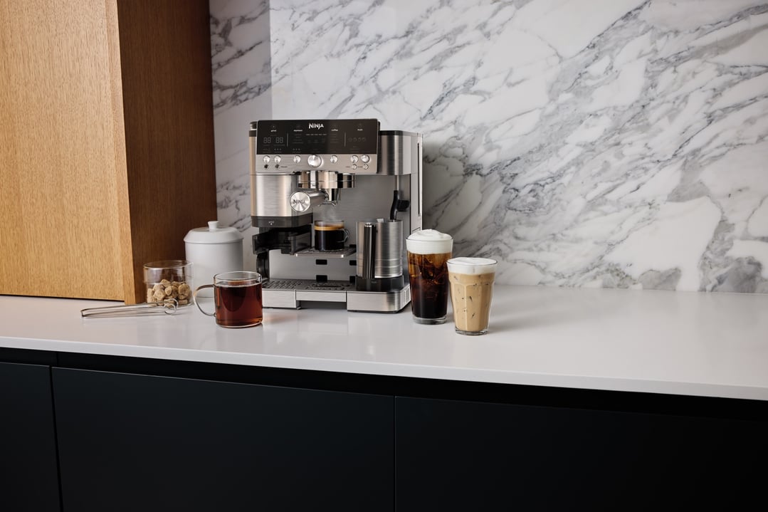 Ninja Luxe Café Premier coffee machine on a kitchen counter with drinks