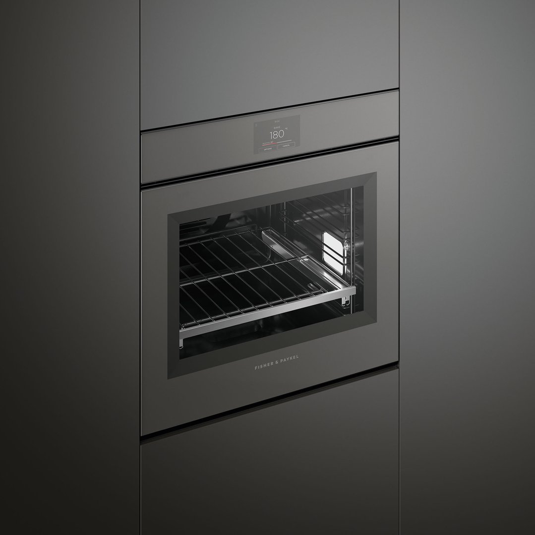 Built-in oven with open door and digital display showing 180 degrees Celsius