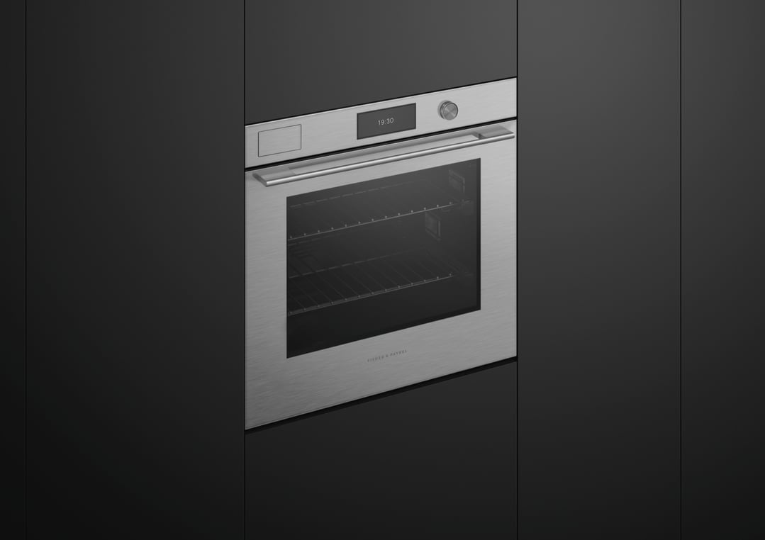 A built-in Fisher & Paykel oven with a digital display showing 19:30