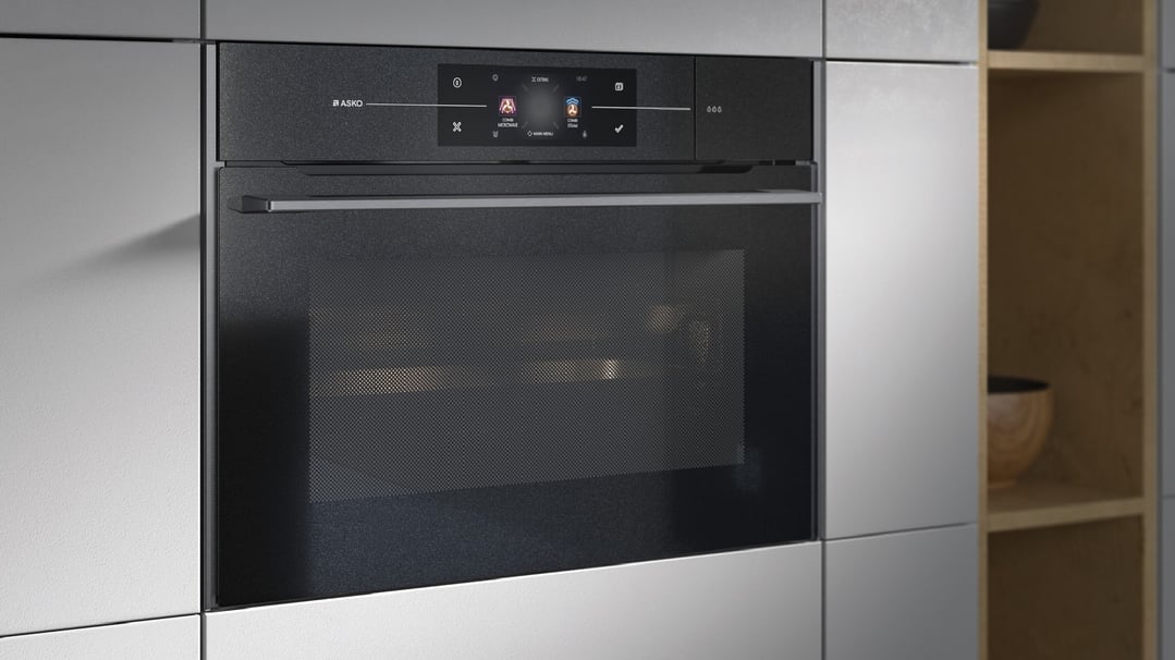 Built-in ASKO compact combi-microwave-steam oven with screen displaying menu options
