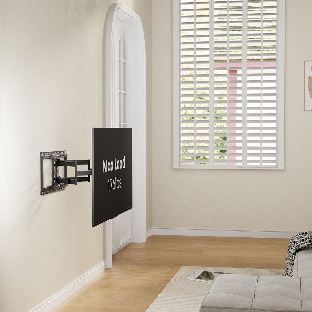 Full motion TV wall mount with a TV in a living room setting