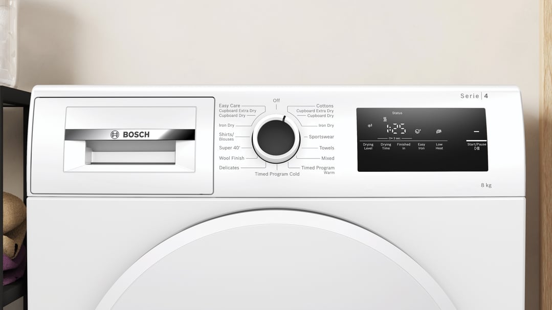 Close up of a white Bosch heat pump tumble dryer control panel