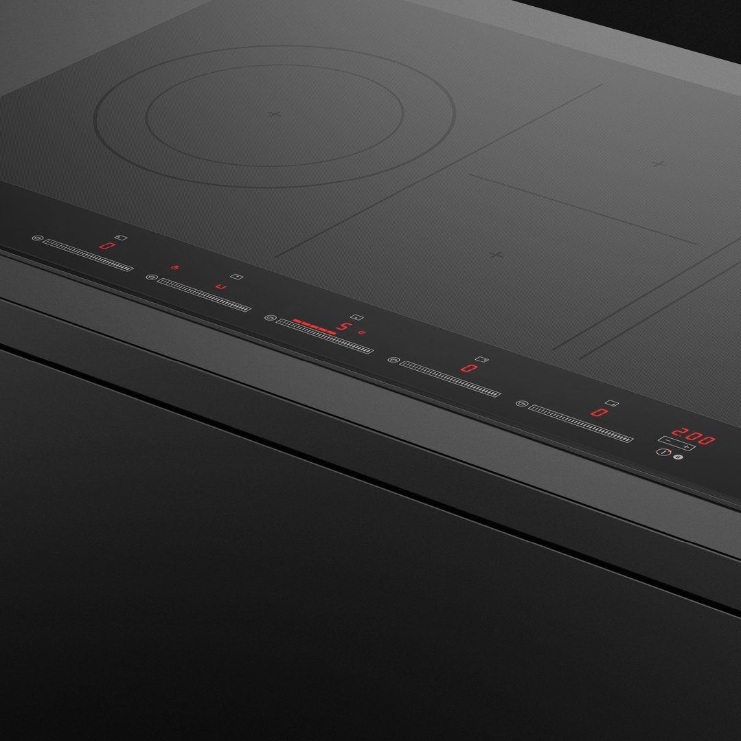 Close up of a black induction cooktop with red digital controls