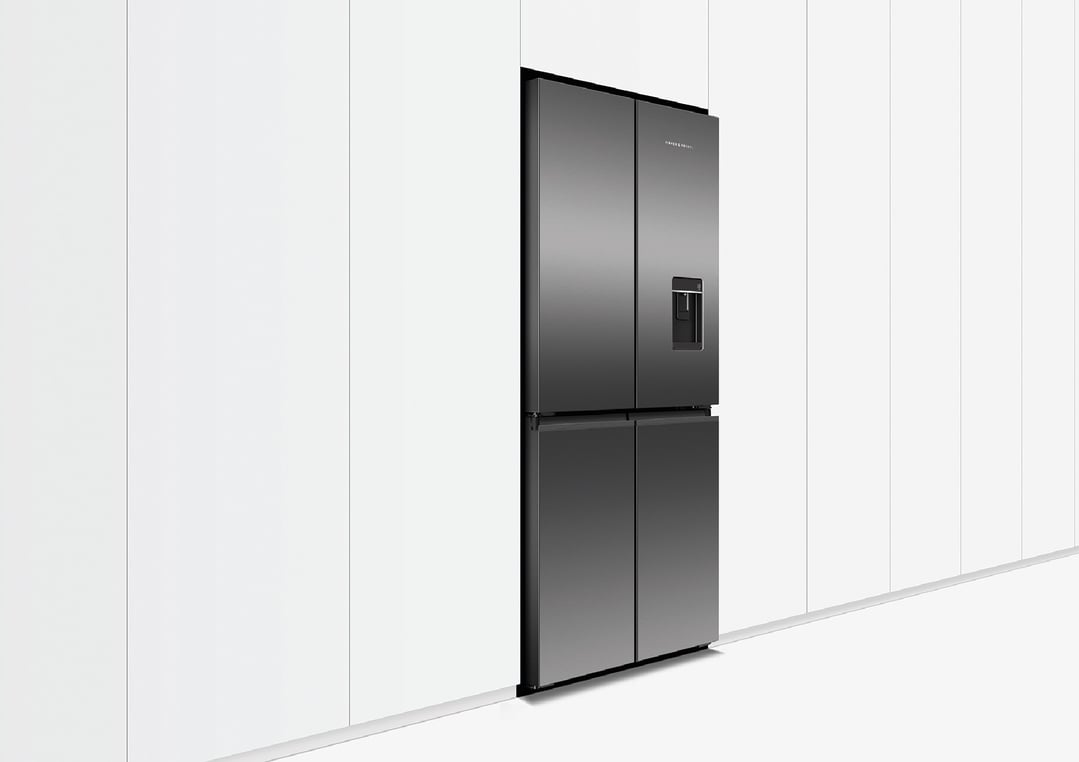 Black quad door refrigerator freezer with ice and water dispenser in a kitchen