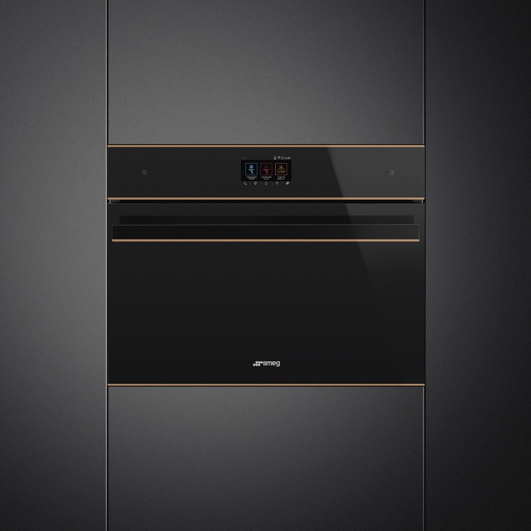 Black Smeg blast chiller built into dark cabinetry with a bronze trim