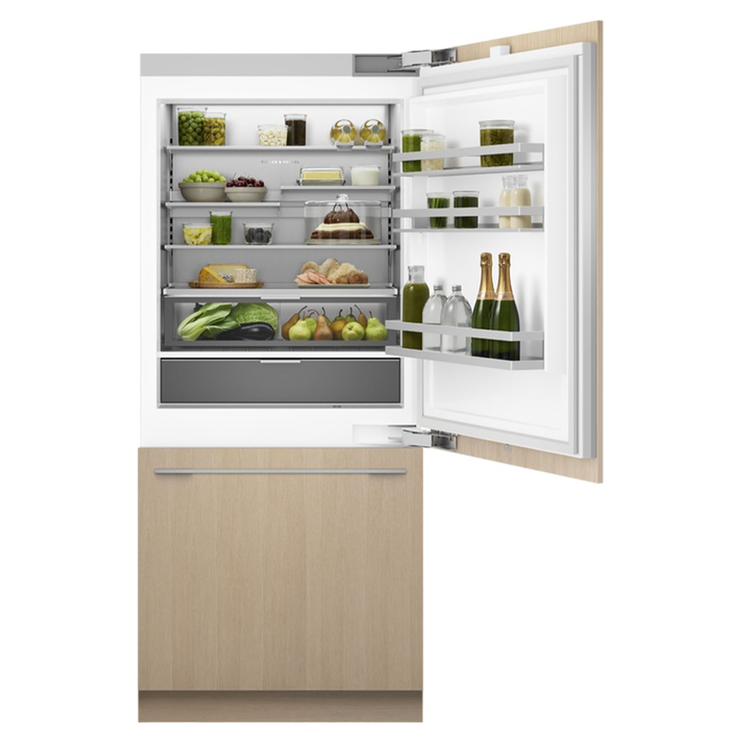Integrated refrigerator freezer with door open, filled with food and drinks