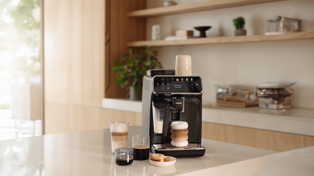 Philips Series 4400 espresso machine on a kitchen counter with coffee drinks
