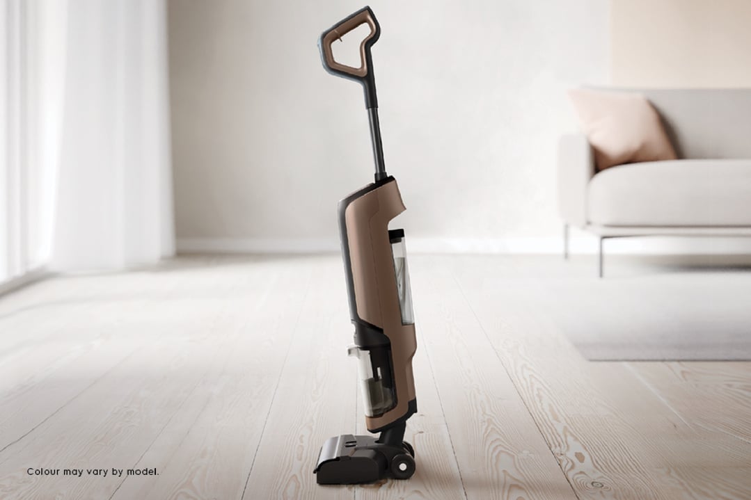 Brown and black wet and dry vacuum cleaner in a living room