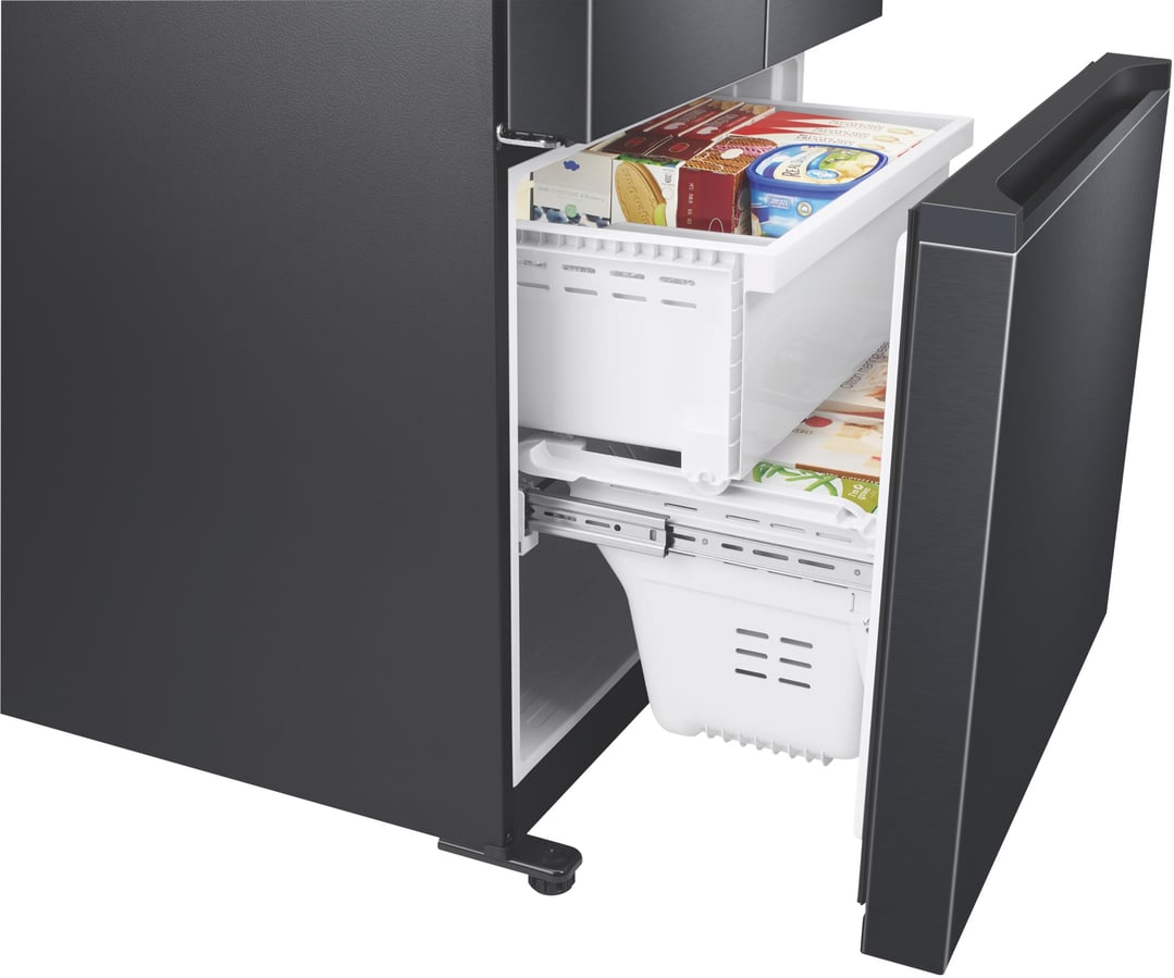 Open freezer drawer of a black refrigerator showing various frozen foods