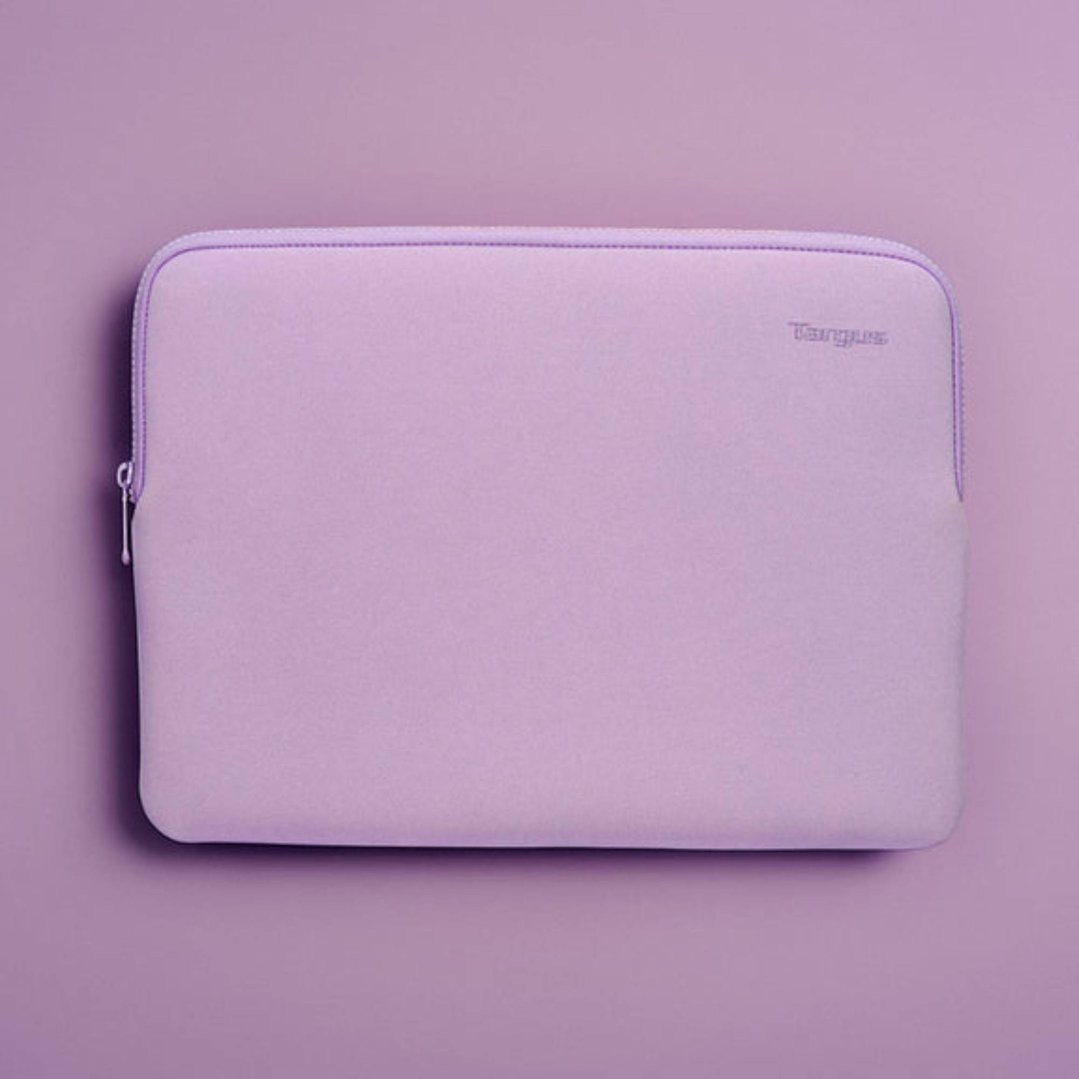 Purple laptop sleeve with a zipper on a purple background