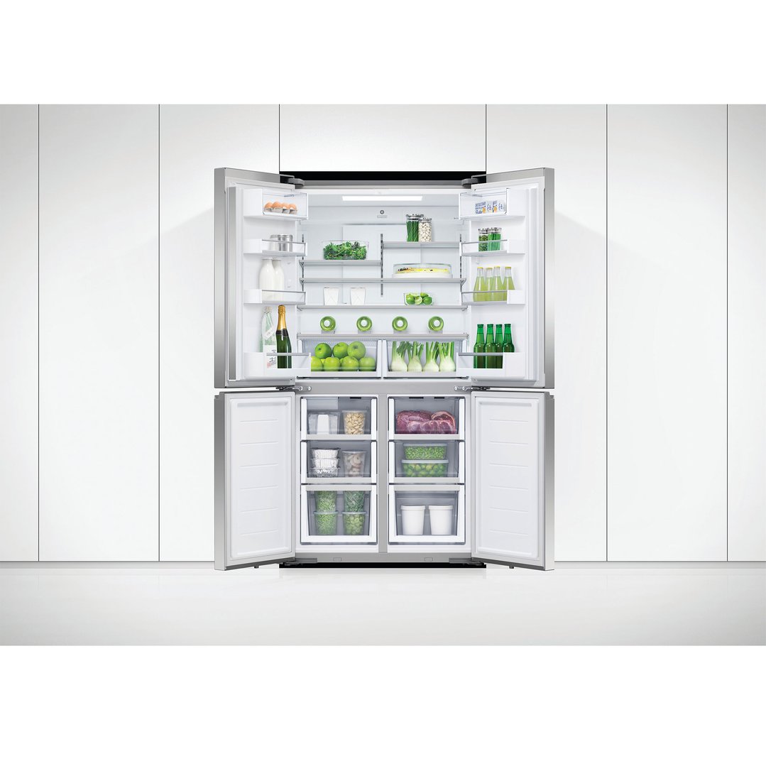 Quad door refrigerator freezer with all doors open, filled with food and drinks