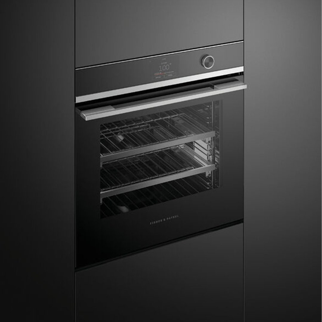 Black built-in combi-steam oven with a digital display and control knob