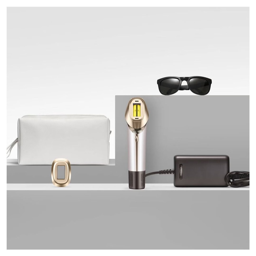 Astra IPL Hair Removal device with accessories on a multi-level gray surface