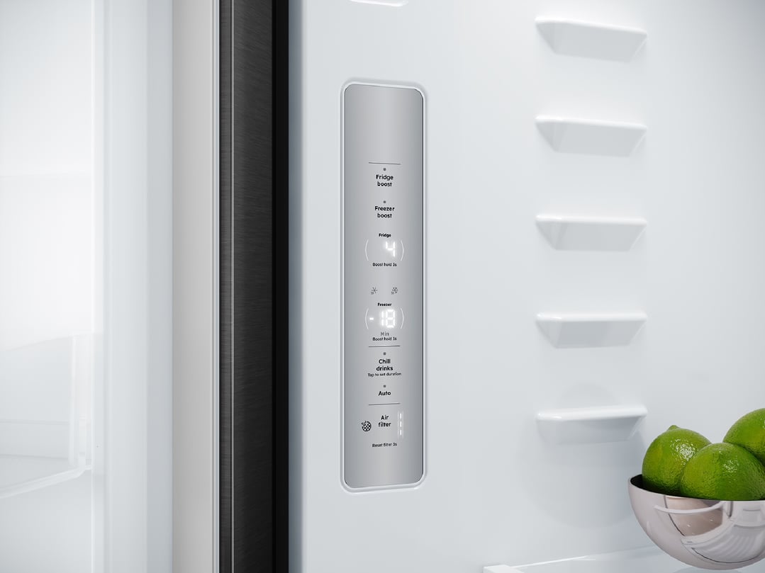 Close up of the fridge's interior control panel and limes in a bowl