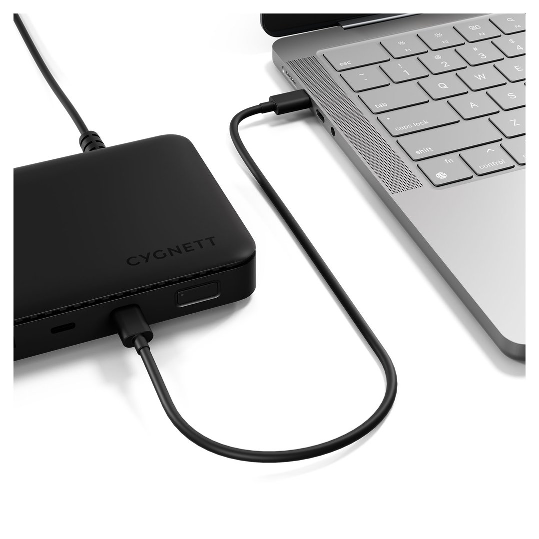 USB-C docking station connected to a laptop on a white surface
