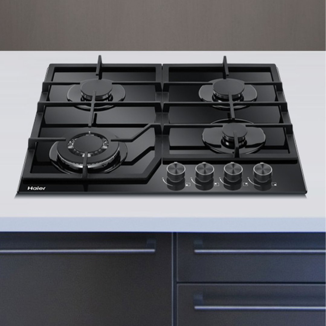 Haier 60cm 4 burner gas on glass cooktop in a modern kitchen setting