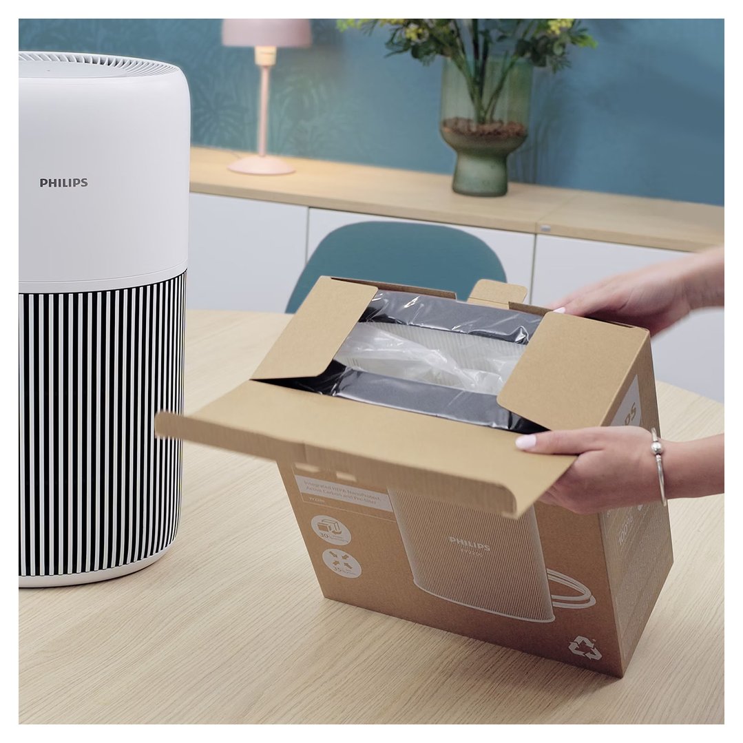 Hands opening a box containing PureProtect Quiet 2200 Series HEPA NanoProtect Filter