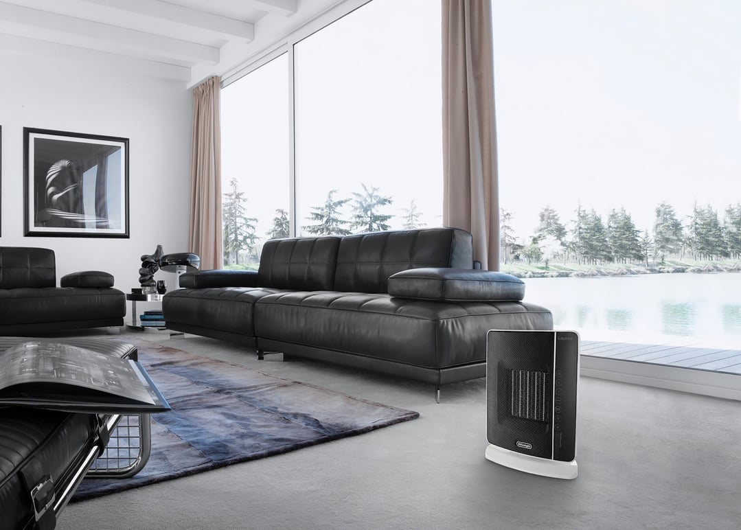 Digital ceramic tower heater on the floor in a modern living room