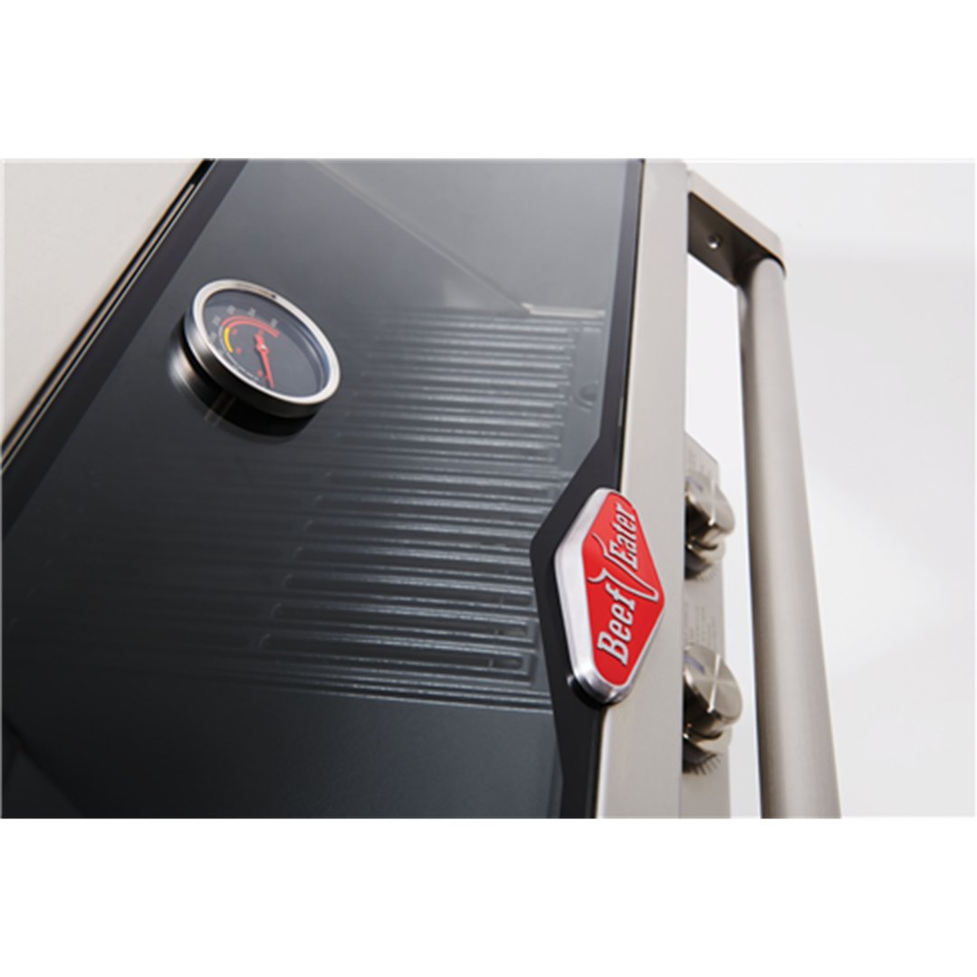 Close-up of a BeefEater barbeque with a temperature gauge and logo