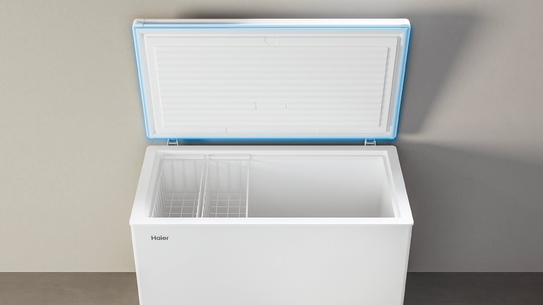 Haier chest freezer with the lid open, showing the interior and baskets