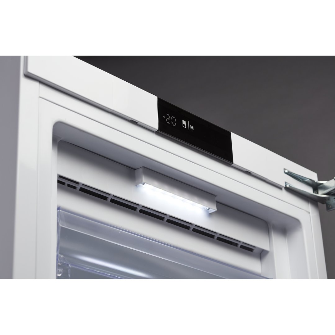 Close up of the interior of a freezer with the light on
