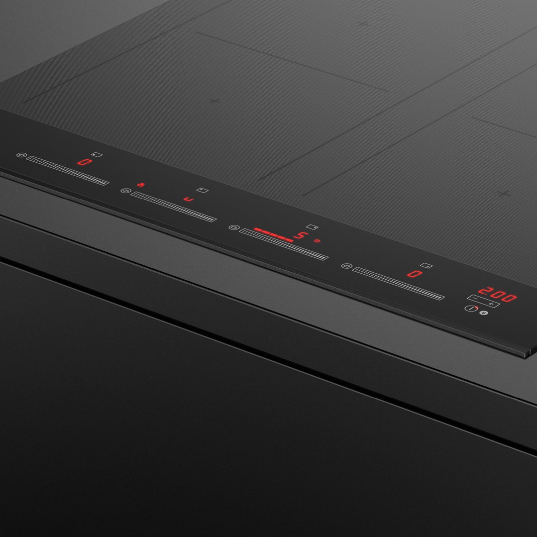 Close up of a black induction cooktop with red digital controls